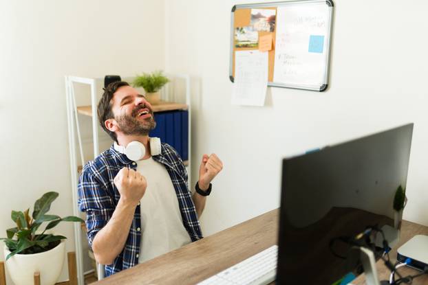 Excited,Programmer,At,The,Office,Celebrating,Finishing,Coding,And,Developing