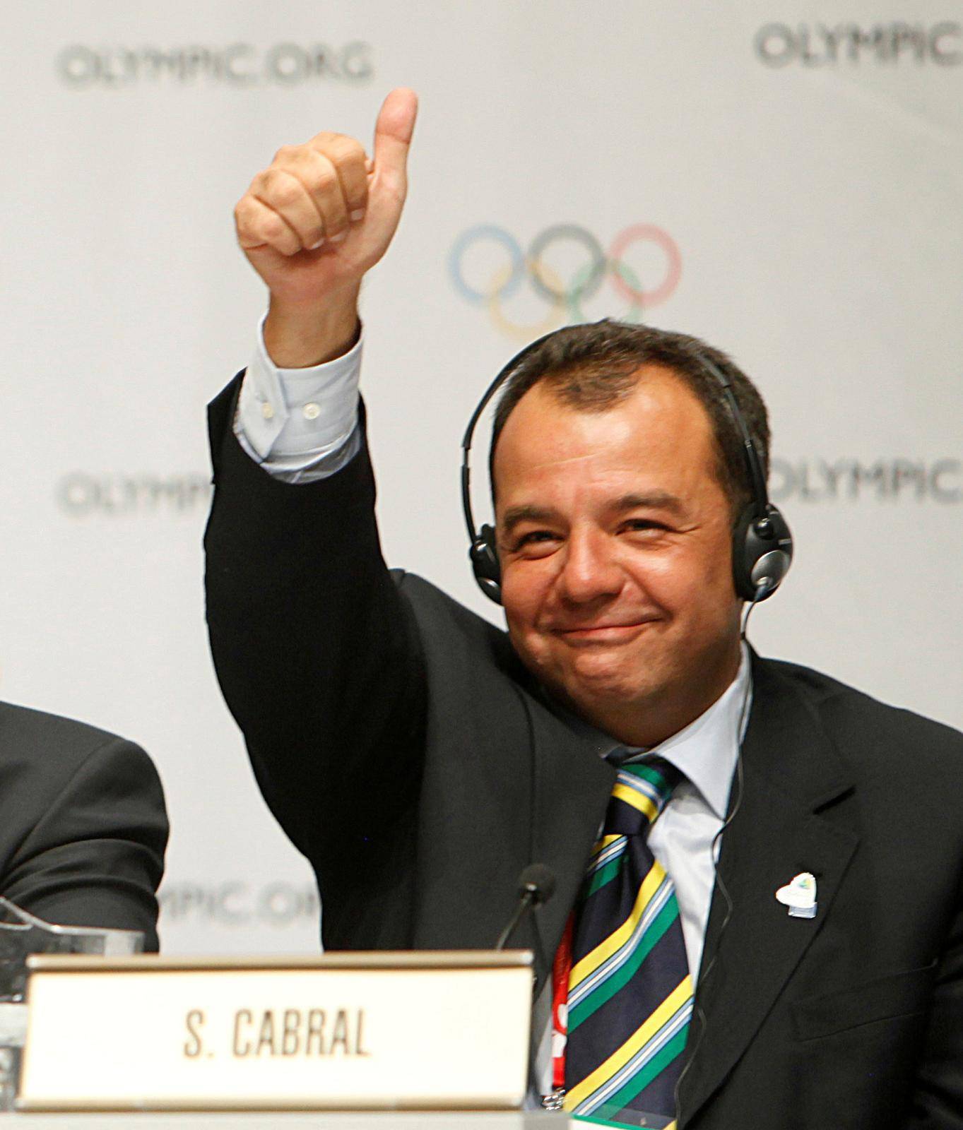FILE PHOTO: Rio de Janeiro Governor Cabral celebrates during a news conference following the signing of the host city contract after Rio de Janeiro was announced as the winning city bid for the 2016 Olympic Games at the 121st IOC session in Copenhagen