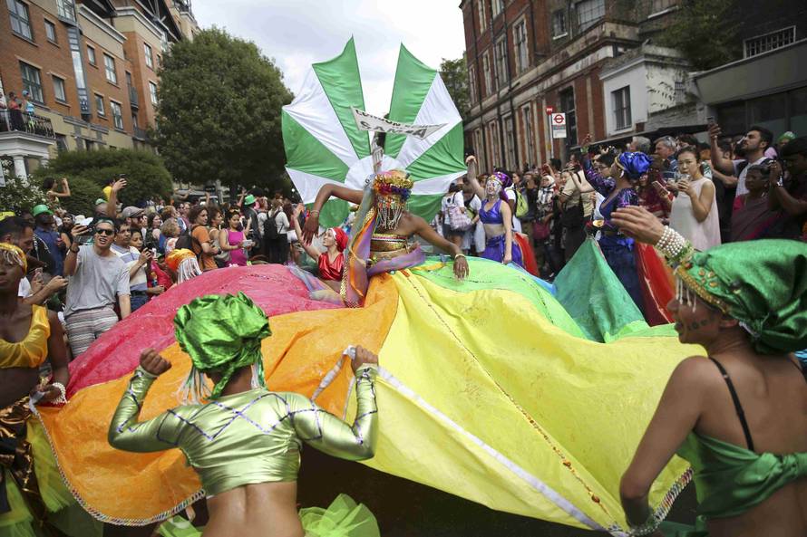 Performers participate in the parade at the Notting Hill Carnival in London