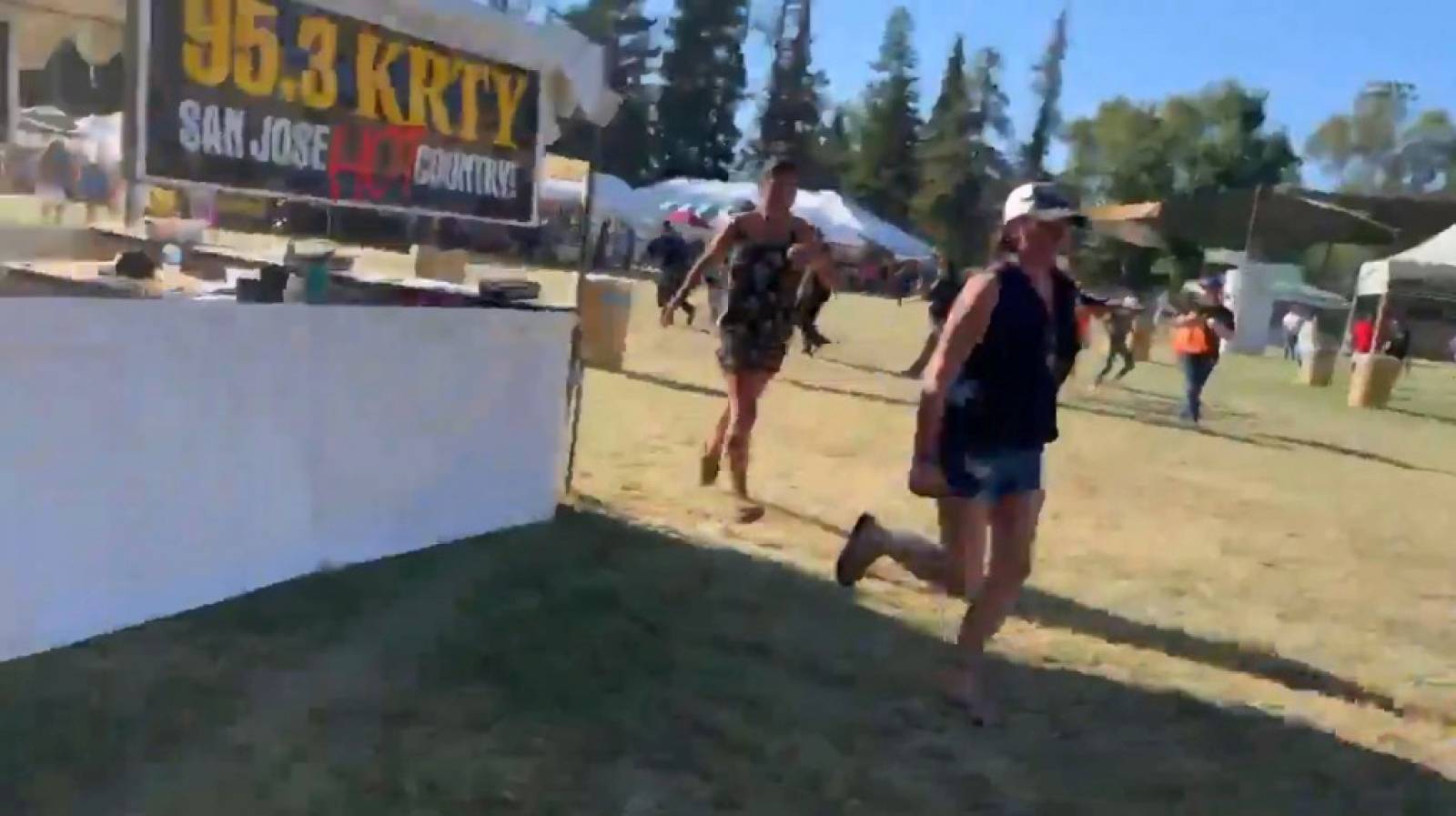 Social media video grab of people running away as an active shooter was reported at the Gilroy Garlic Festival, south of San Jose, California