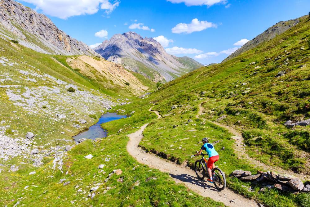 Woman,Tourist,Cycling,On,Mtb,Bike,In,Beautiful,Alpisella,Valley