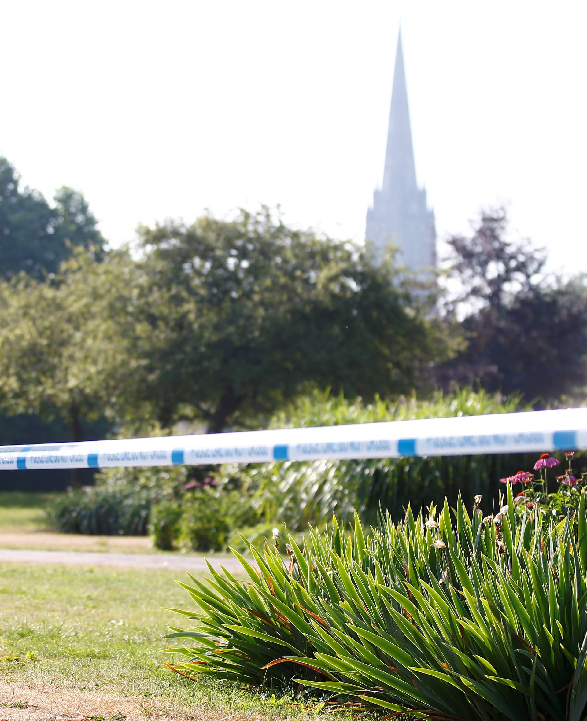 FILE PHOTO: A police officer guards a cordoned off area of Queen Elizabeth Gardens, after it was confirmed that two people had been poisoned with the nerve-agent Novichok, in Salisbury