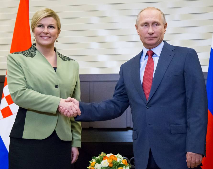 Croatian President Kolinda Grabar-Kitarovic and Putin pose for a photo during their meeting in Sochi