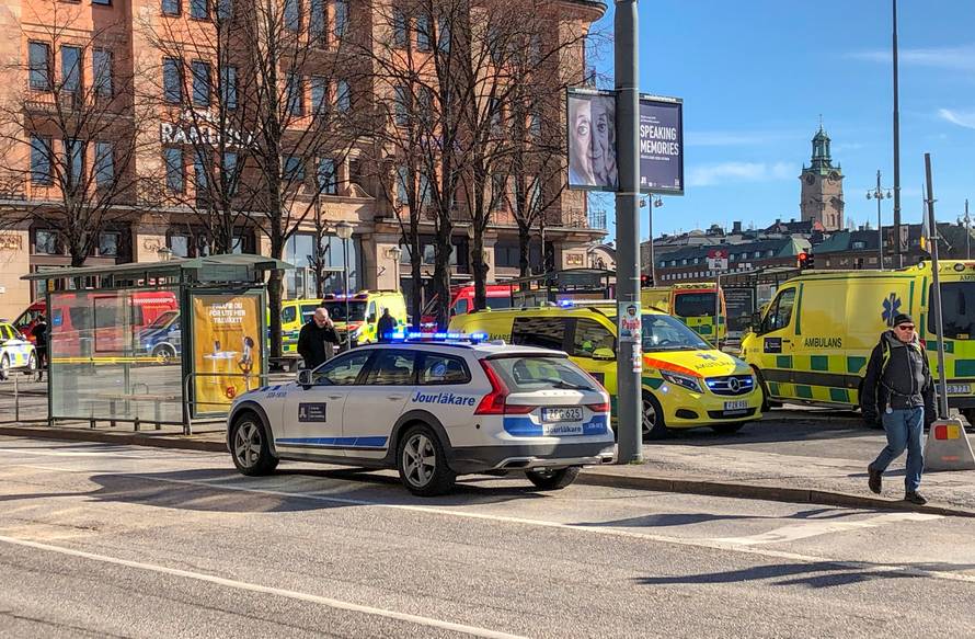 Emergency services are seen after a bus exploded and caught fire in Tegelbacken in central Stockholm