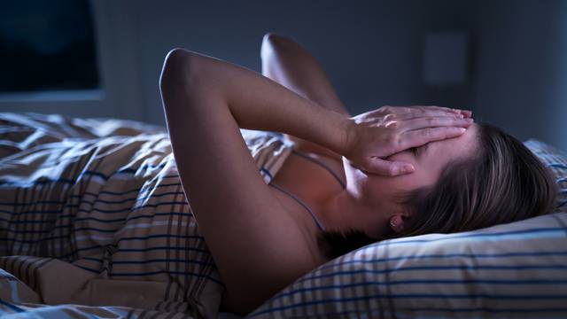 Insomnia, sleep apnea or stress concept. Sleepless woman awake a