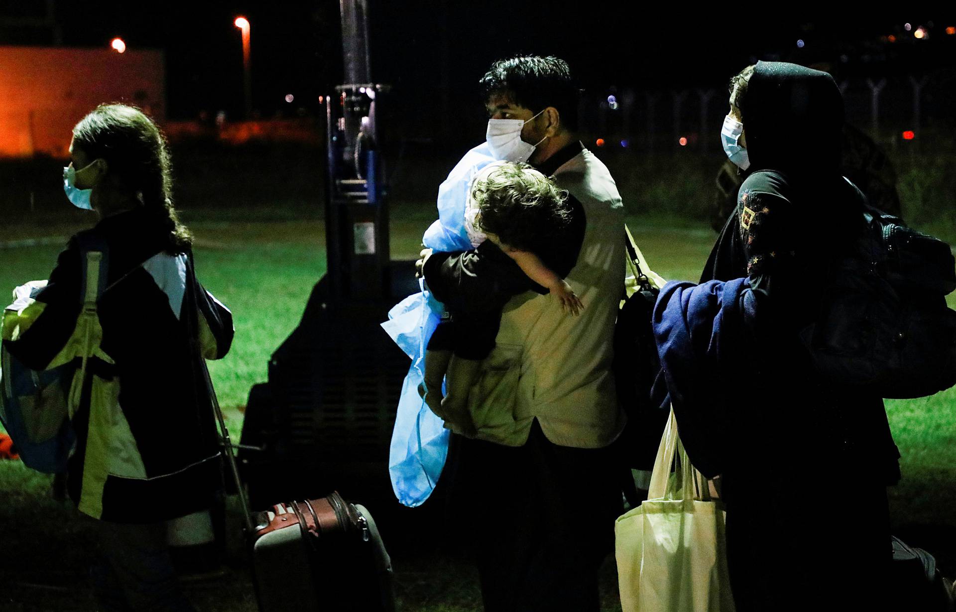 People evacuated from Afghanistan arrive at Tirana International Airport