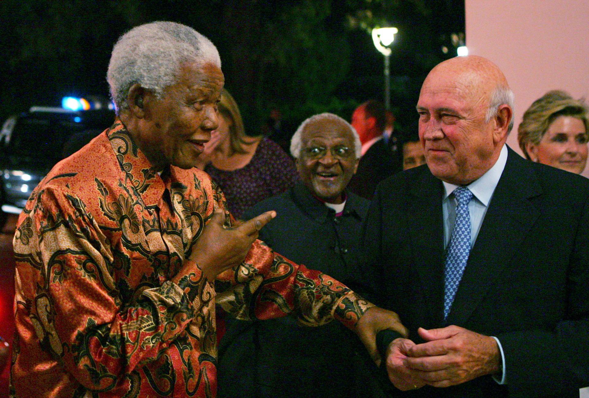 FILE PHOTO: South African Nobel Peace Laureates Mandela and  Archbishop Tutu arrive for birthday celebrations of fellow laureate former President de Klerk in Cape Town