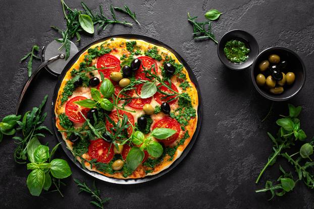 Pizza. Traditional italian pizza with green basil pesto sauce