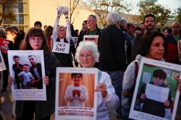 Israelis take part in an anti-war protest in Tel Aviv