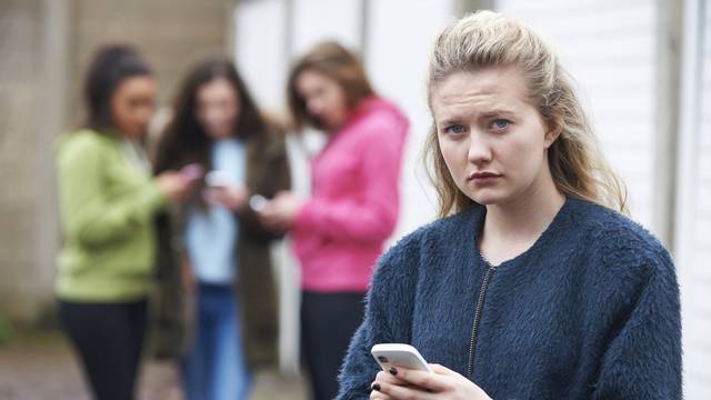Teenage,Girl,Being,Bullied,By,Text,Message