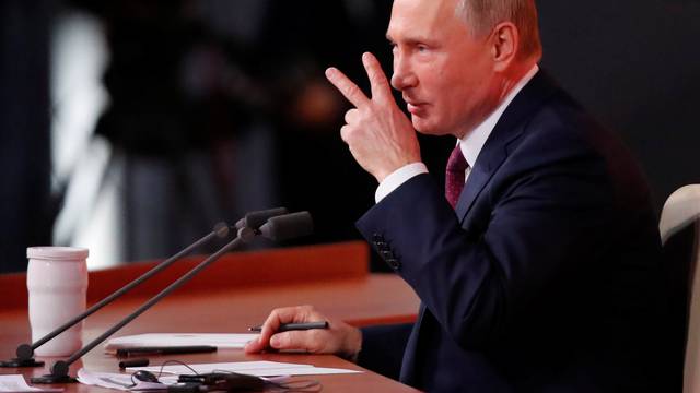 Russian President Vladimir Putin speaks during his annual end-of-year news conference in Moscow