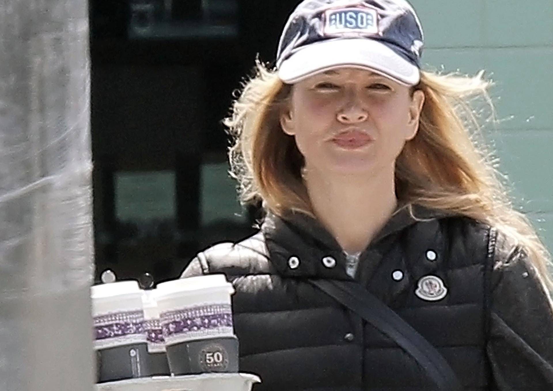EXCLUSIVE: Renee Zellweger displays her significantly larger lips as she goes on a coffee run at Peet's Coffee & Tea