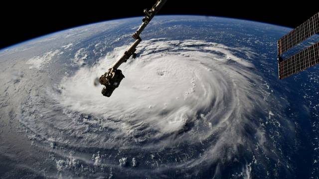 FILE PHOTO: NASA handout photo of Hurricane Florence churning in the Atlantic Ocean towards the east coast of the United States