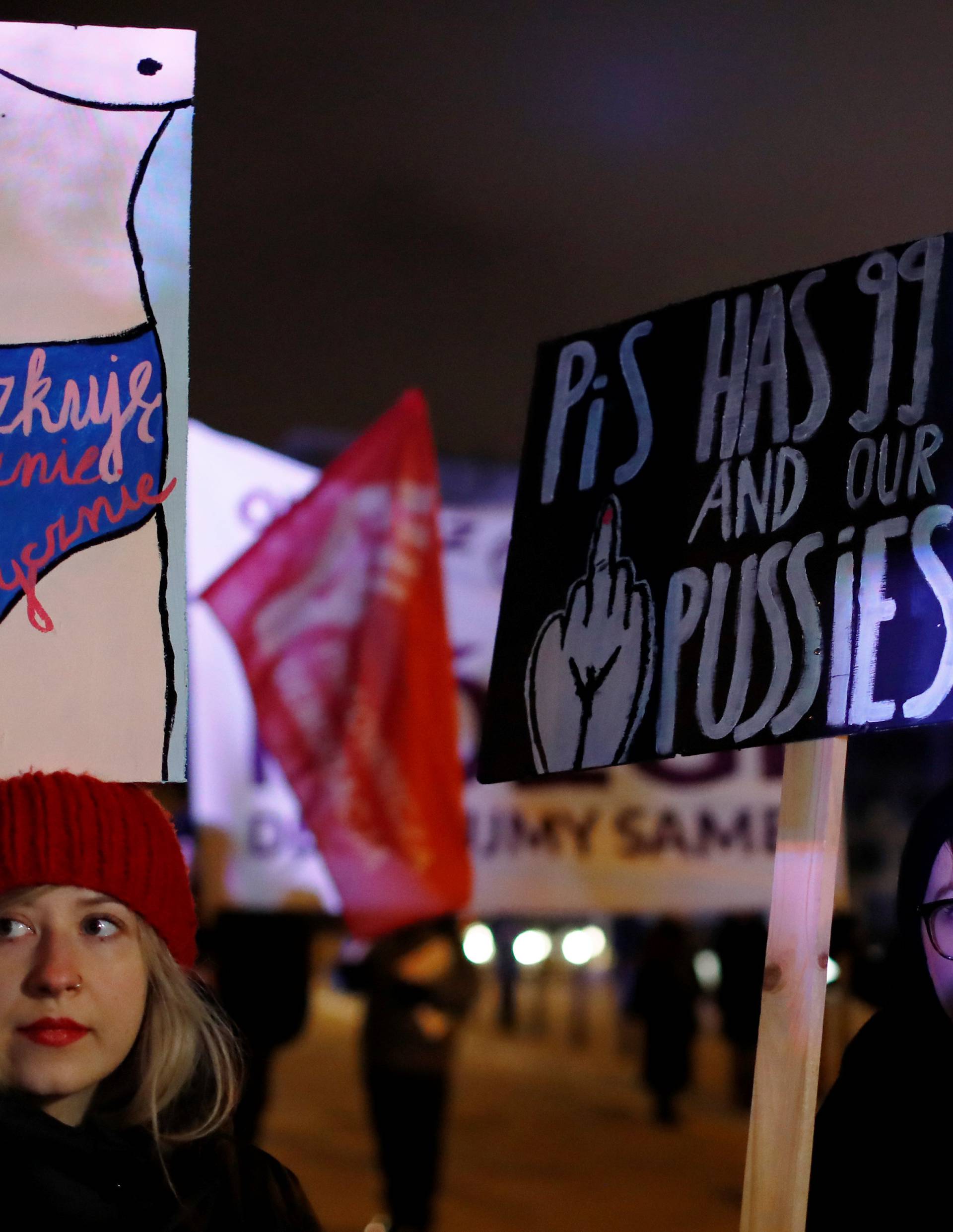 People gather to protest against plans to further restrict abortion laws in front of the Parliament in Warsaw