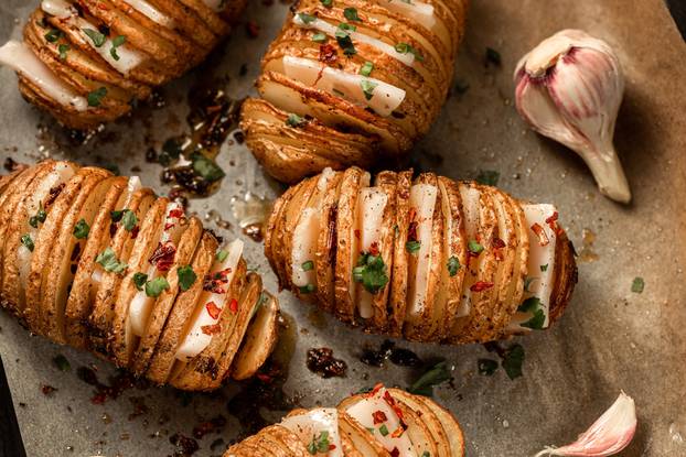 Hasselback,Baked,Potatoes,With,Fresh,Herbs,And,Pork,Fat,,Lard,