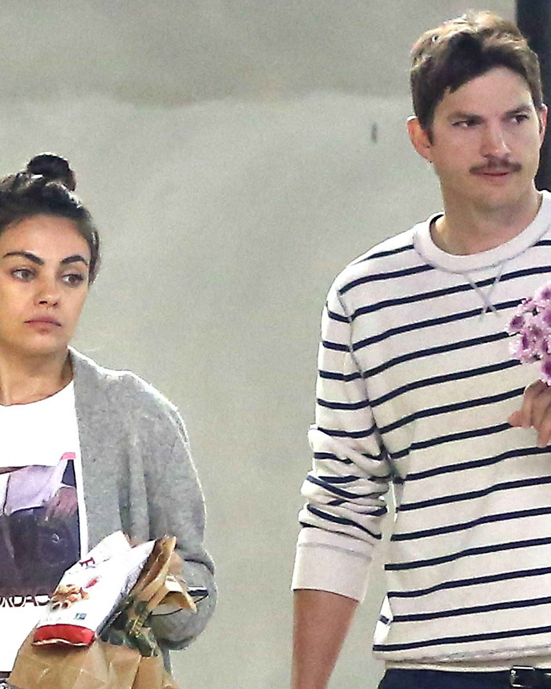 EXCLUSIVE: Mila Kunis and Ashton Kutcher out in Los Angeles buying some flowers