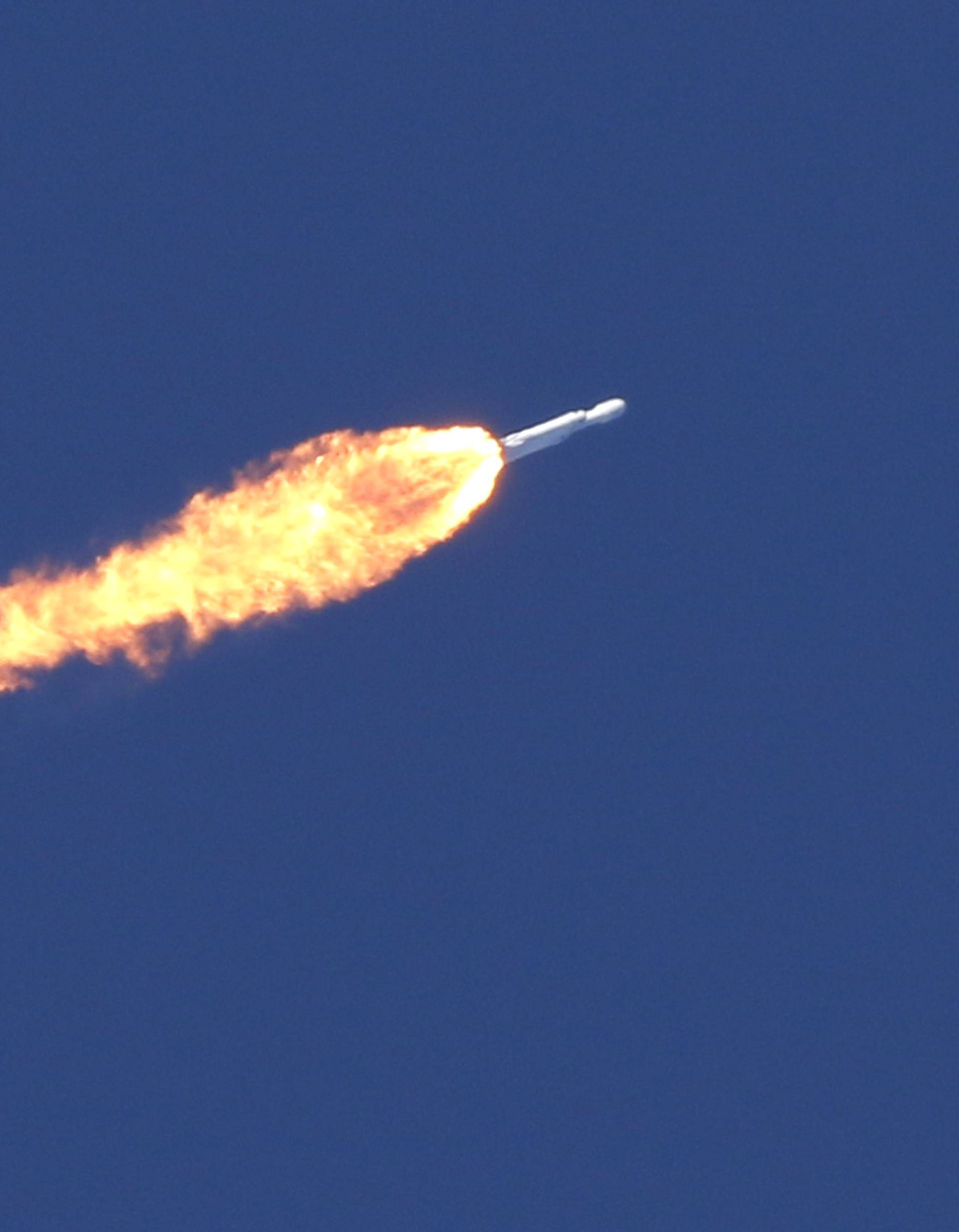 A SpaceX Falcon Heavy rocket lifts off from the Kennedy Space Center in Cape Canaveral