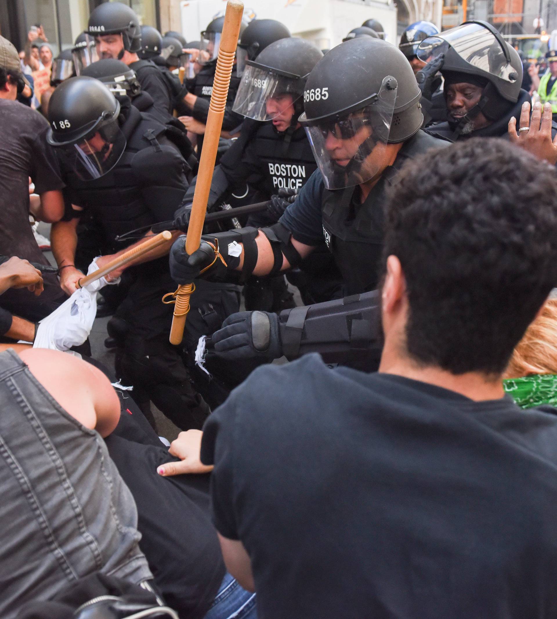 A crowd of counter protesters clashes with Boston Police outside of the Boston Commons and the Boston Free Speech Rally in Boston, Massachusetts