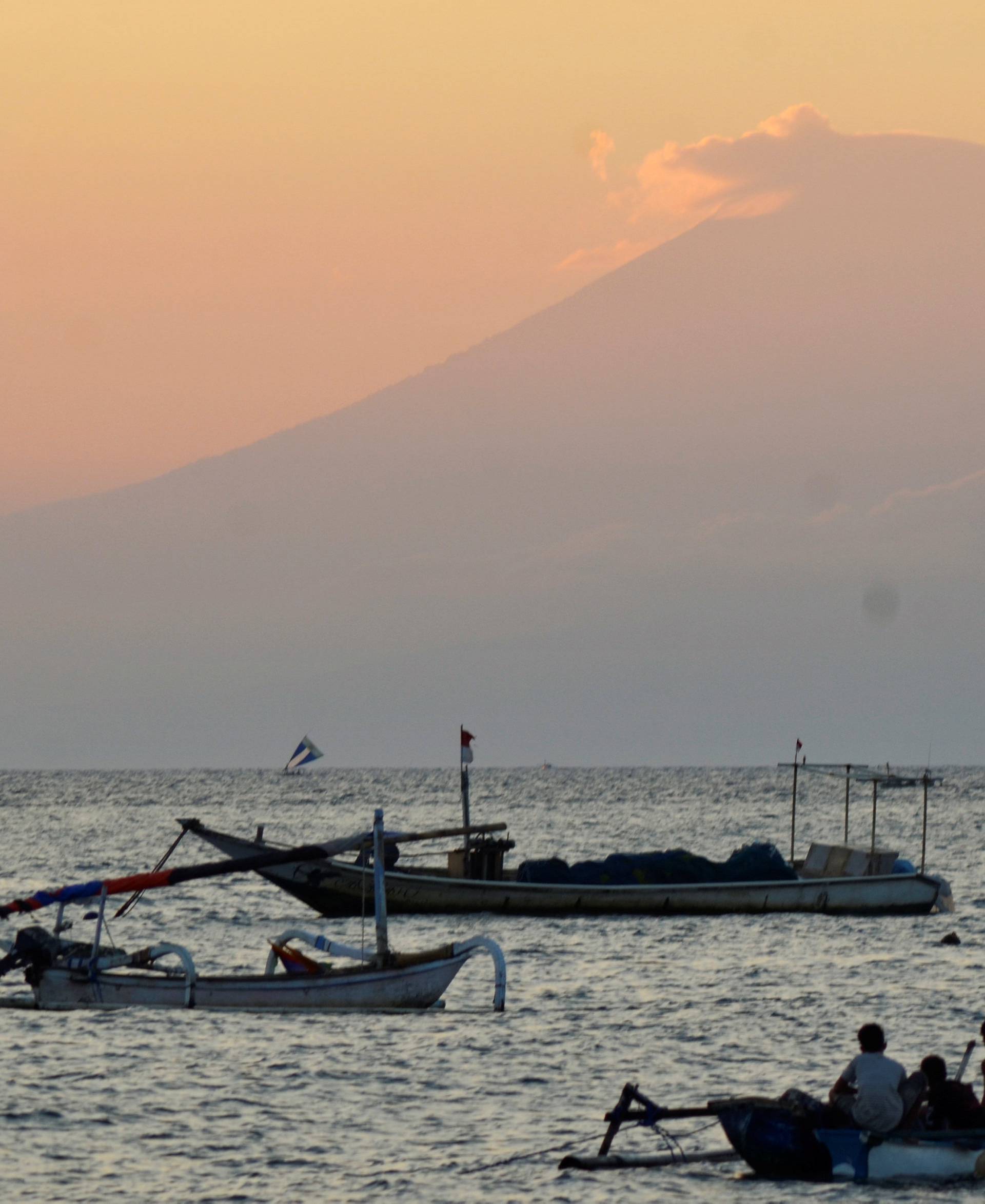 Mount Agung, an active volcano located on the resort island of Bali that has been placed on alert level 3 following recent seismic activity, is seen from Mataram on nearby Lombok island