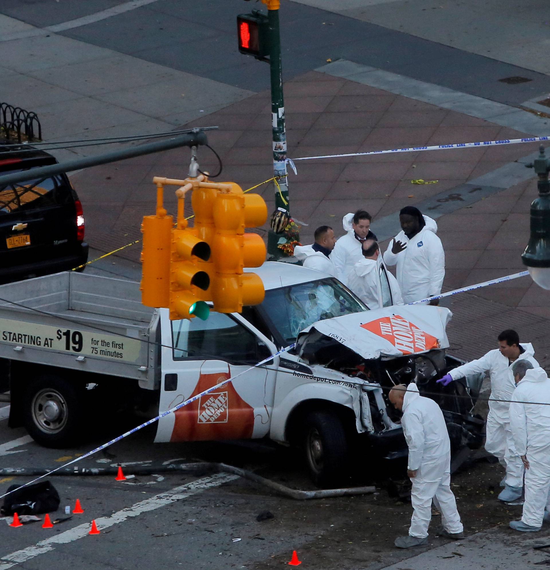 Police investigate a vehicle allegedly used in a ramming incident on the West Side Highway in Manhattan, New York, U.S.