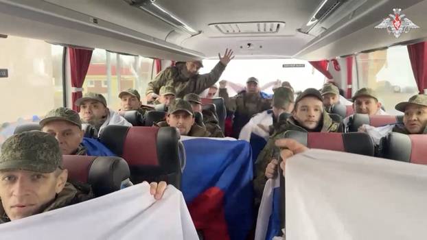 Freed Russian prisoners of war board a bus in Belarus