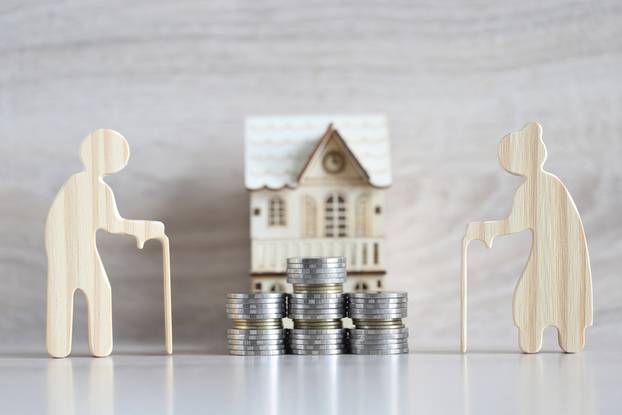 Mutual,Fund,love,Couple,Senior,And,Model,House,On,Wooden,Background,