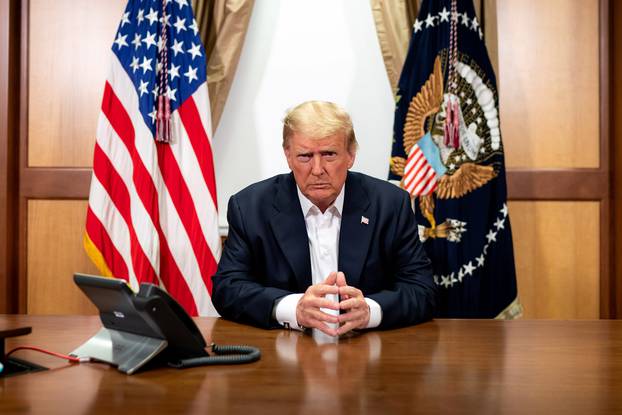 U.S. President Trump participates in a phone call with Vice President Pence, Secretary of State Pompeo, and Chairman of the Joint Chiefs of Staff Gen. Milley in his conference room at at Walter Reed National Military Medical Center
