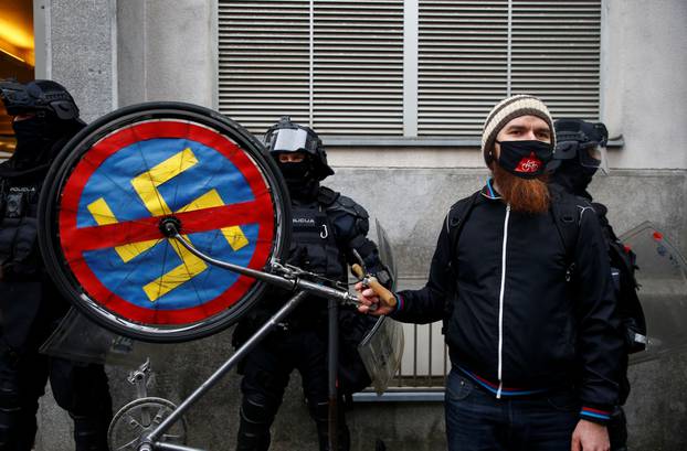 Demonstrators attend an anti-government protest in Ljubljana