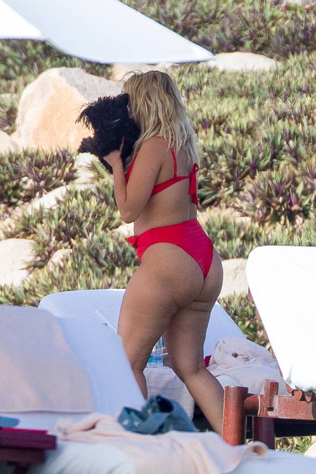 *PREMIUM-EXCLUSIVE* Bebe Rexha shows off her curves in a red bikini while soaking up the sun in Cabo