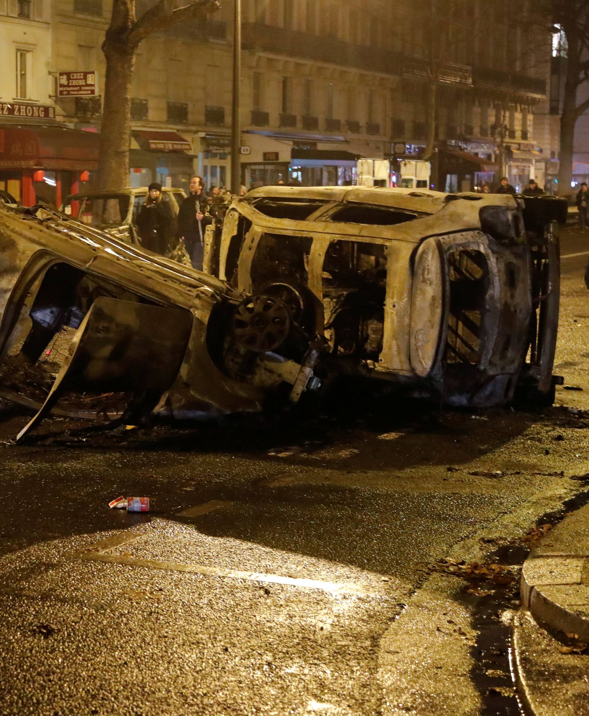 Burned cars are seen on avenue Kleber after clashes with protesters wearing yellow vests, a symbol of a French drivers' protest against higher diesel taxes, in Paris