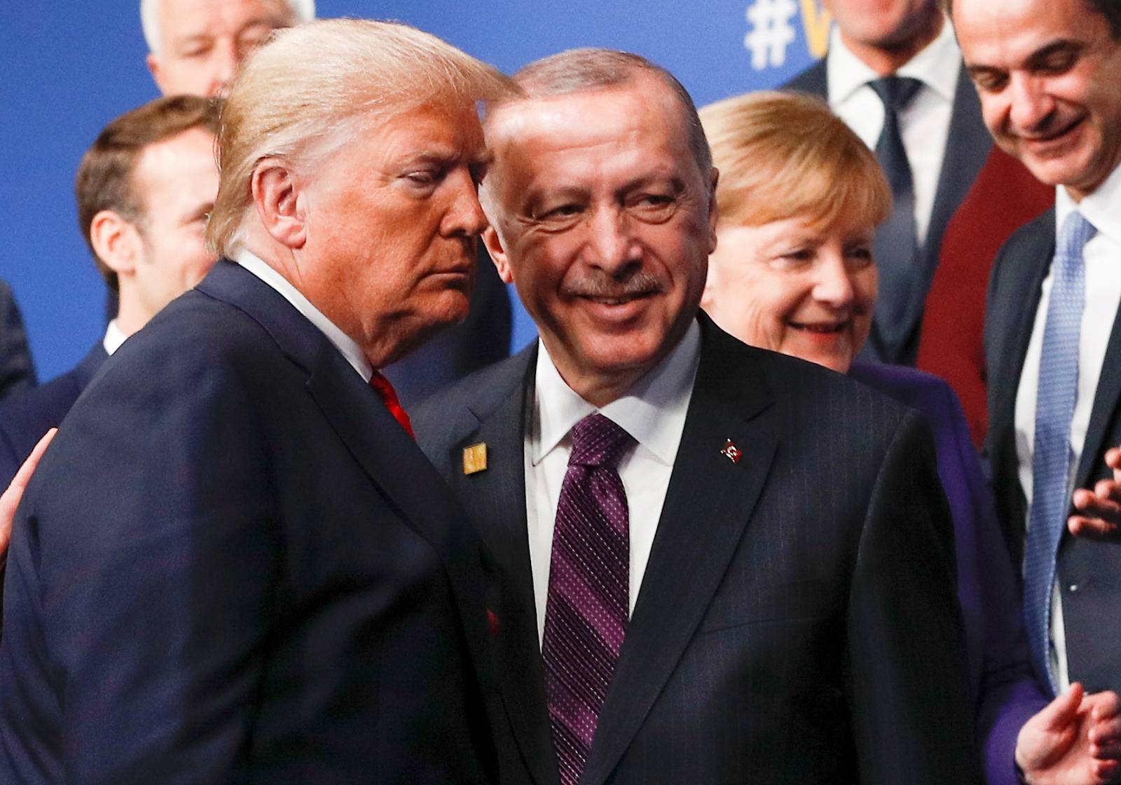 FILE PHOTO: U.S. President Donald Trump and Turkish President Recep Tayyip Erdogan leave the stage after a family photo during the NATO NATO summit in Watford, Britain