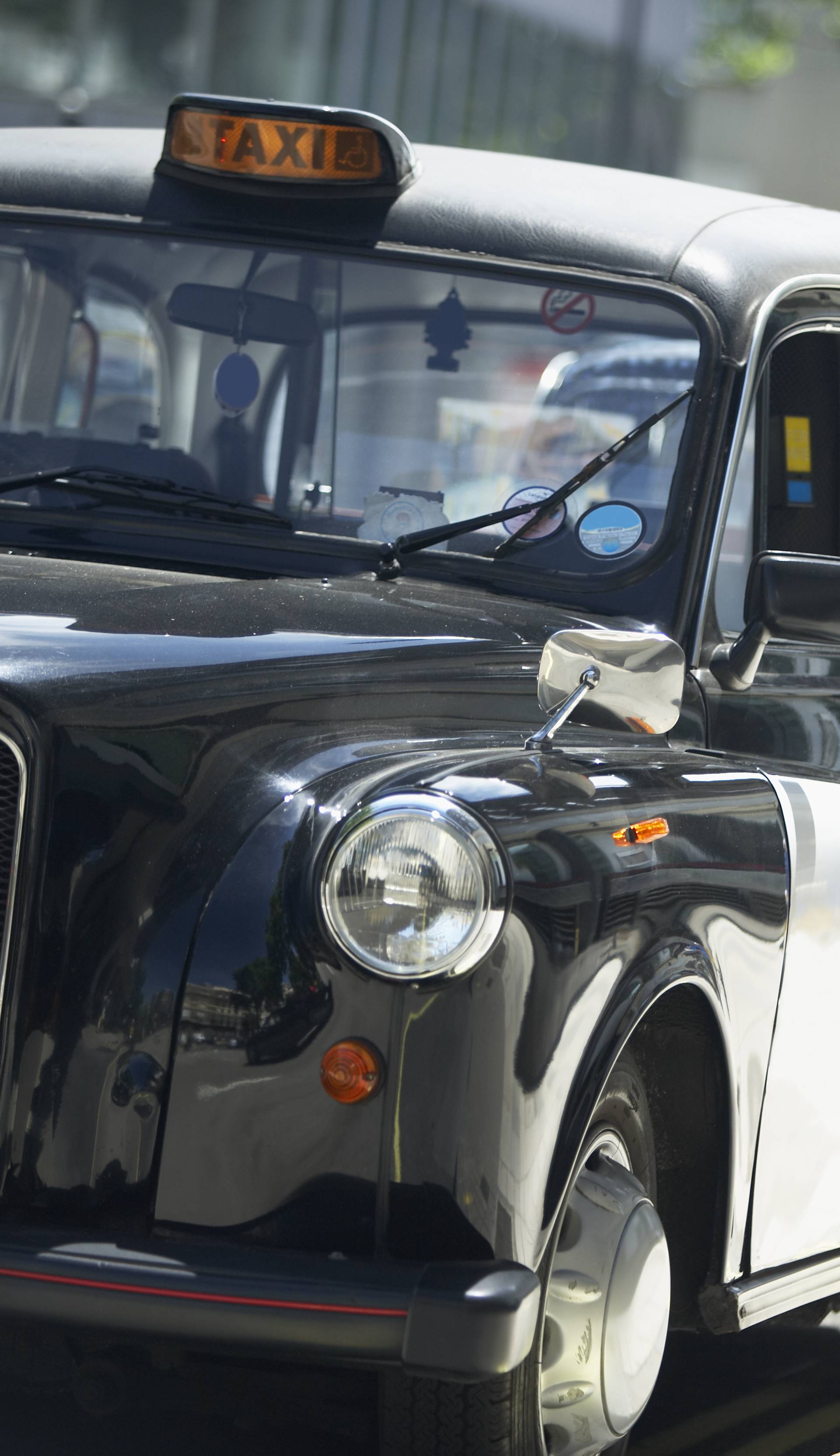 London Taxis Lined Up On Sidewalk