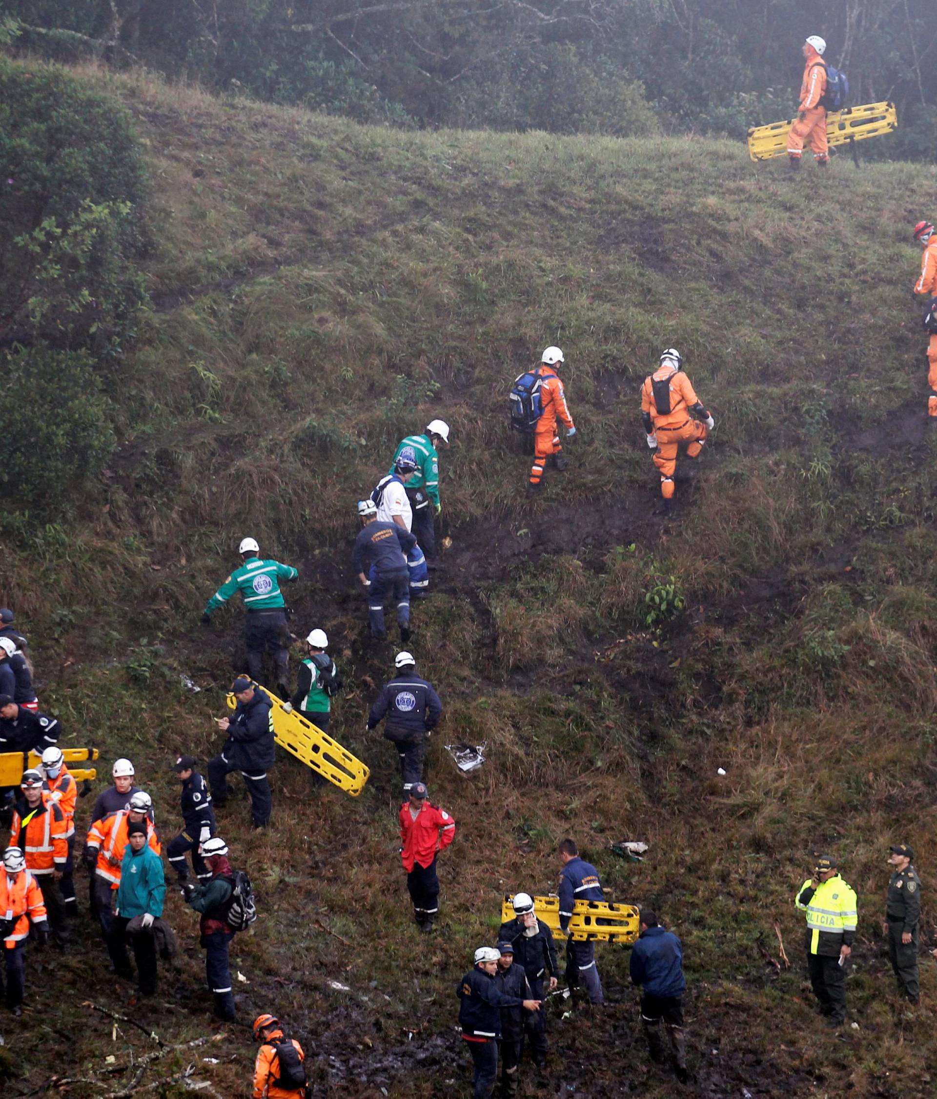 Rescue crew work near the wreckage from a plane that crashed into Colombian jungle with Brazilian soccer team Chapecoense, seen near Medellin