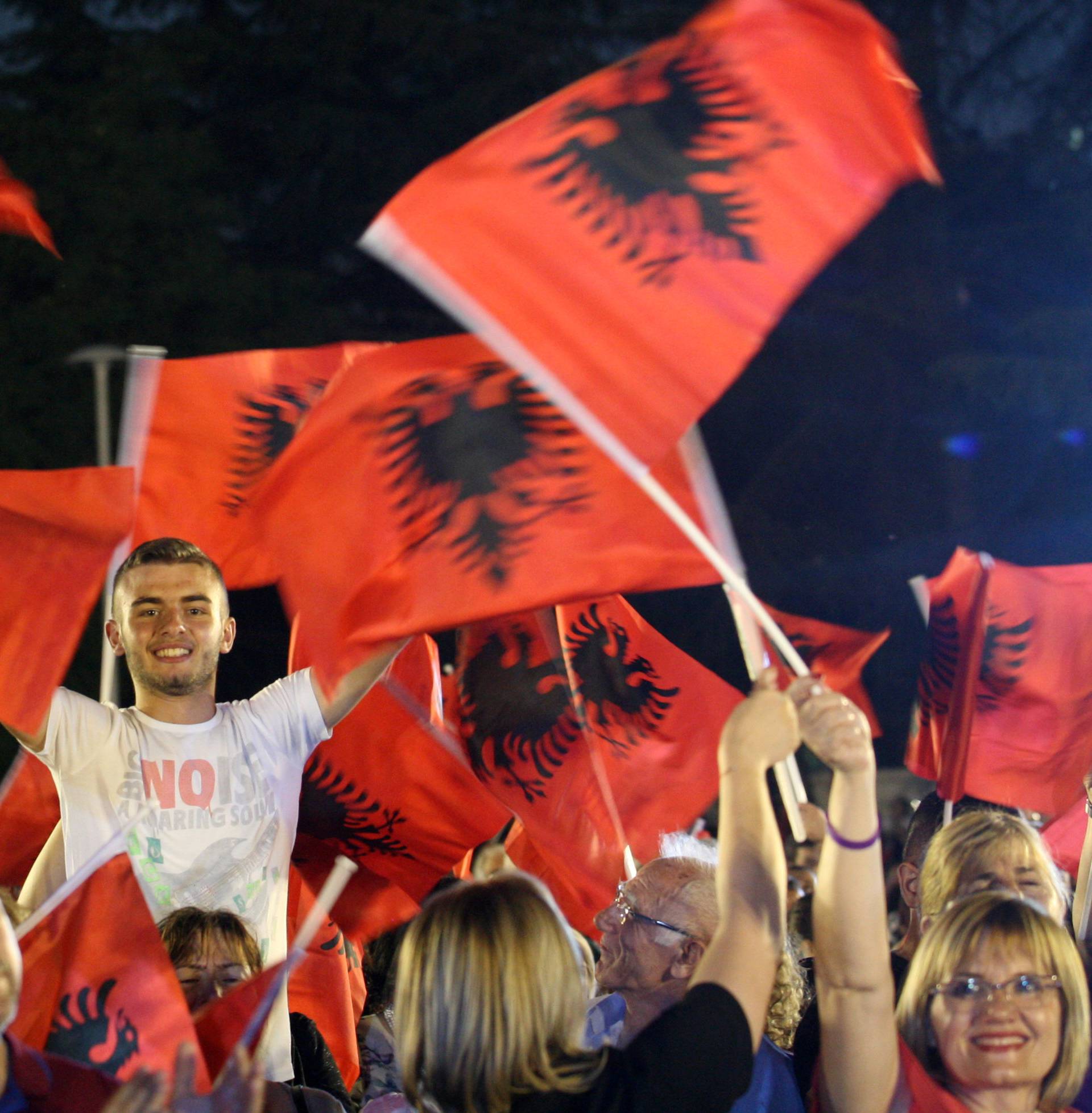 Supporters of Socialist Party wave their flags during a pre-election rally in Tirana, Albania