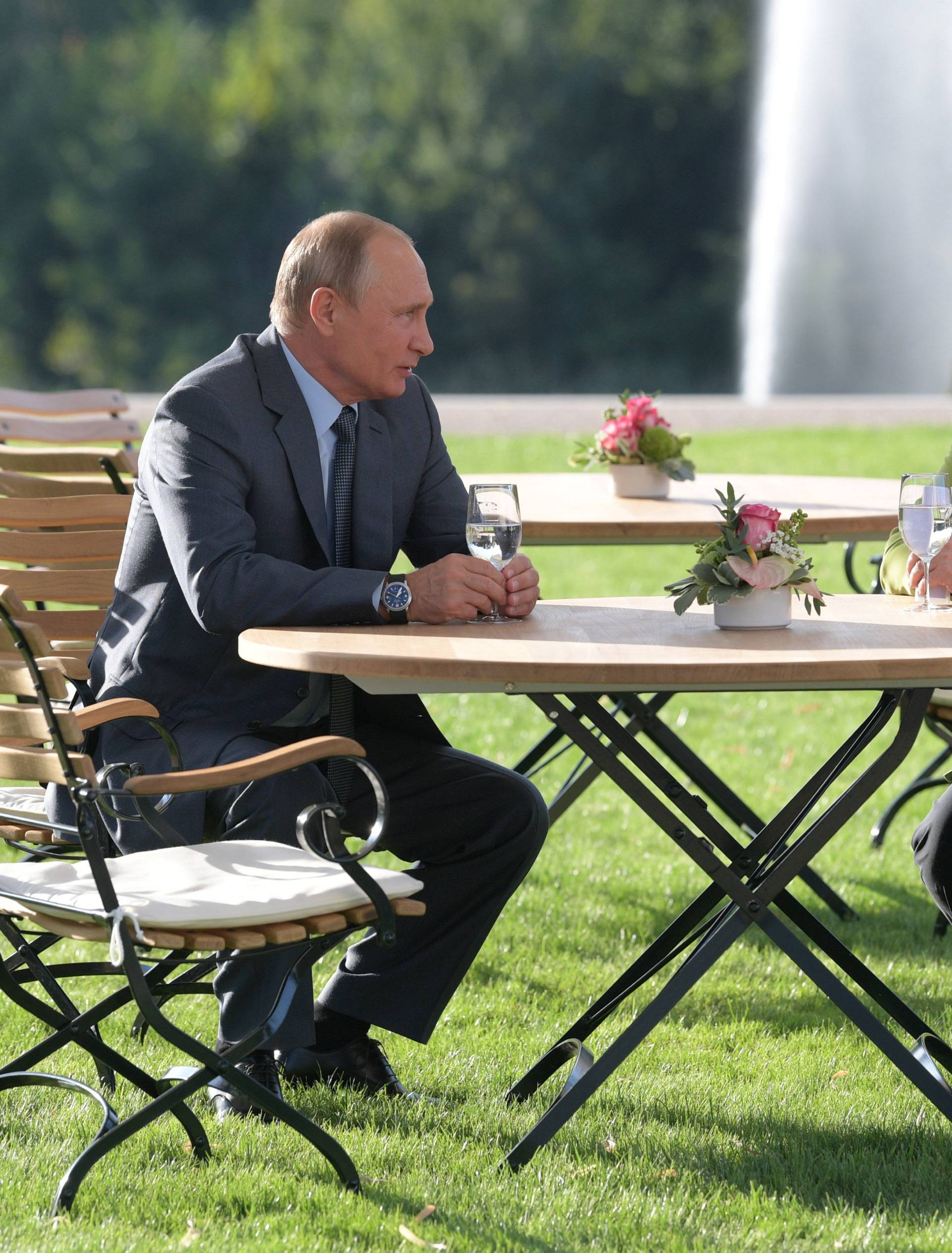 Merkel and Putin speak at Meseberg Palace in Gransee