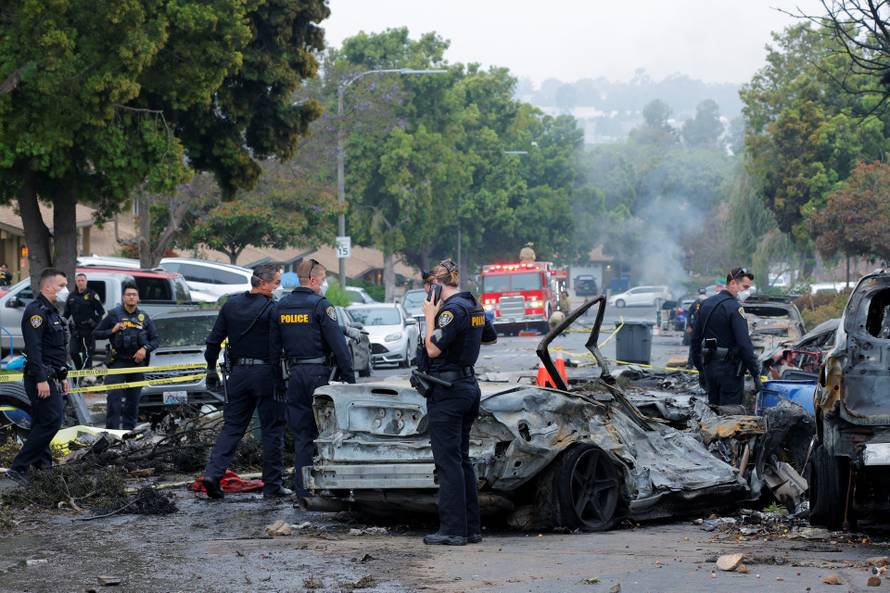 Crash scene after a civilian aircraft went down in a military neighborhood, in San Diego