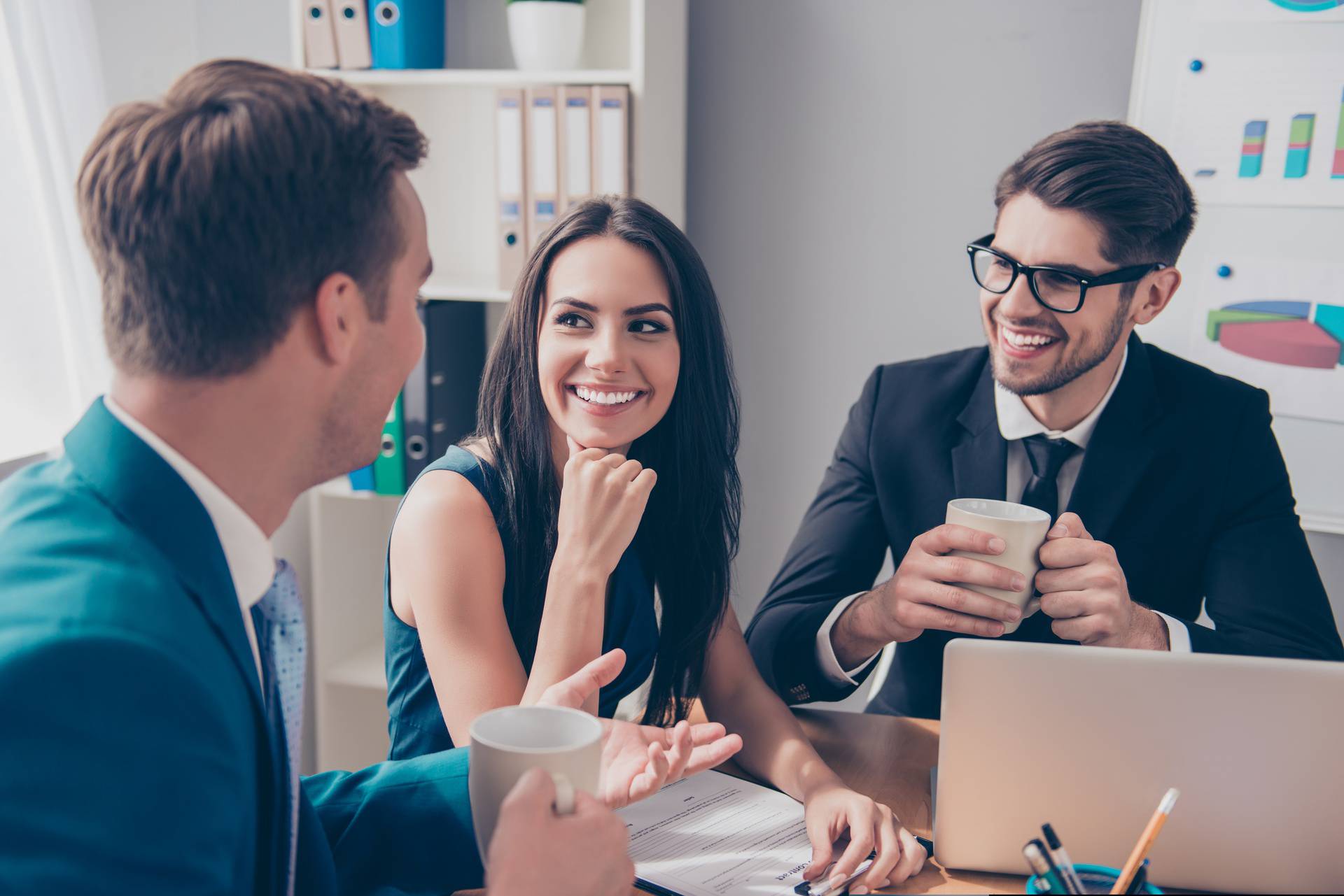 Cheerful,Office,Workers,Discussing,Their,Project,Over,Cup,Of,Tea