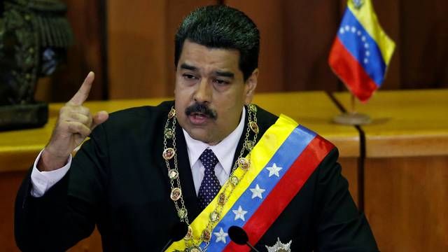 Venezuela's President Nicolas Maduro holds speaks during his annual report of the state of the nation at the Supreme Court in Caracas