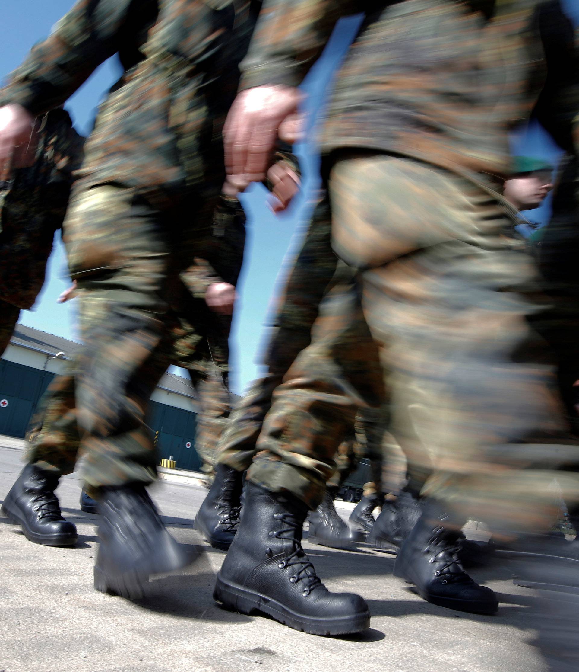 FILE PHOTO: German Bundeswehr armed forces soldiers of the 371st armoured infantry battalion march during a media day of the NATO drill 'NOBLE JUMP 2015' at the barracks in Marienberg