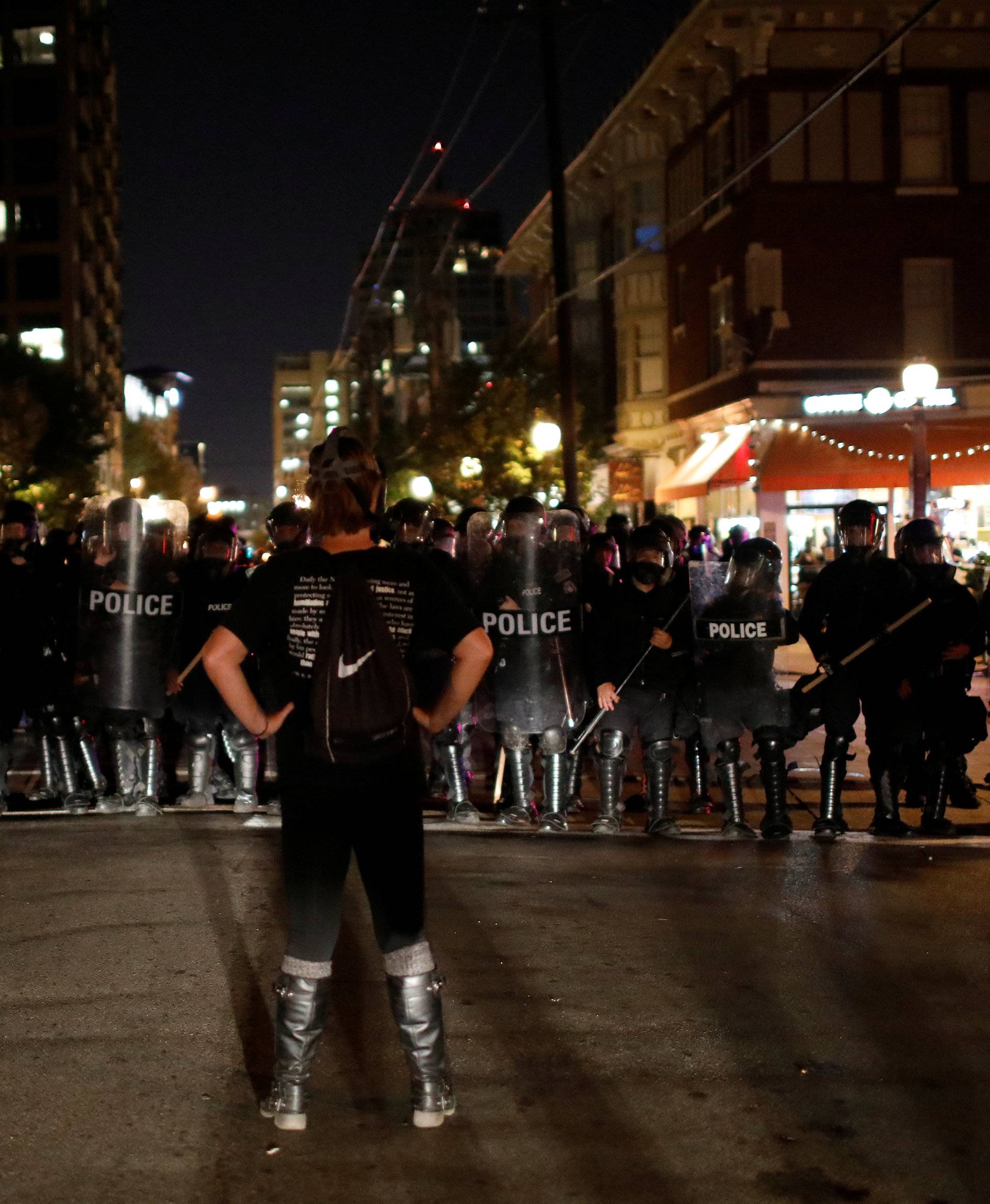 A protester faces off with law enforcement officials in the Central West End neighborhood following acquittal of Stockley in St Louis