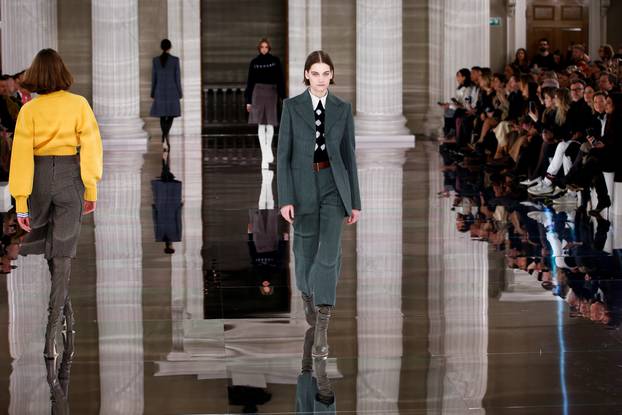 Models present creations at the Victoria Beckham catwalk show during London Fashion Week in London