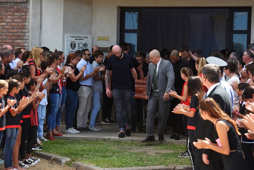 Family and friends carry the coffin of Emiliano Sala, soccer player who died in a plane crash in the English Channel, while a crowd attends his wake in Progreso