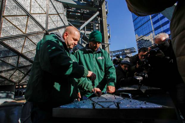 Workers prepare a panel of Waterford Crystal triangles before attaching it to the Times Square New Year