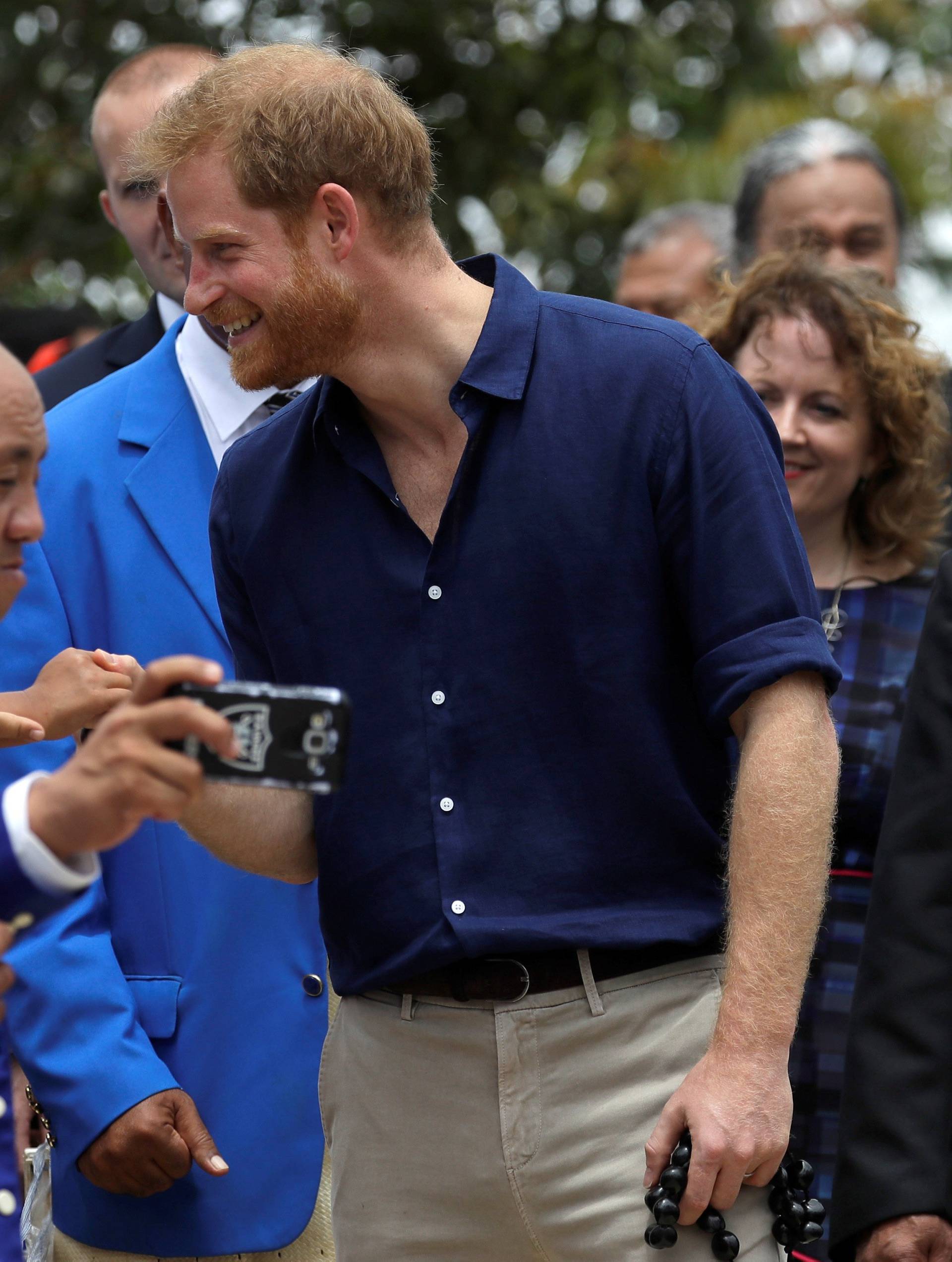 Britain's Prince Harry meets staff and pupils during a visit to Tupou College in Tonga,