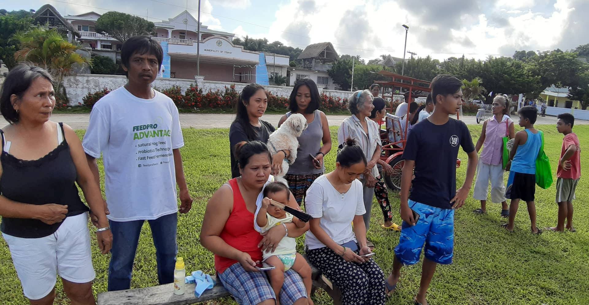 People gather on a field after an earthquake struck the Batanes Province, in northern Philippines