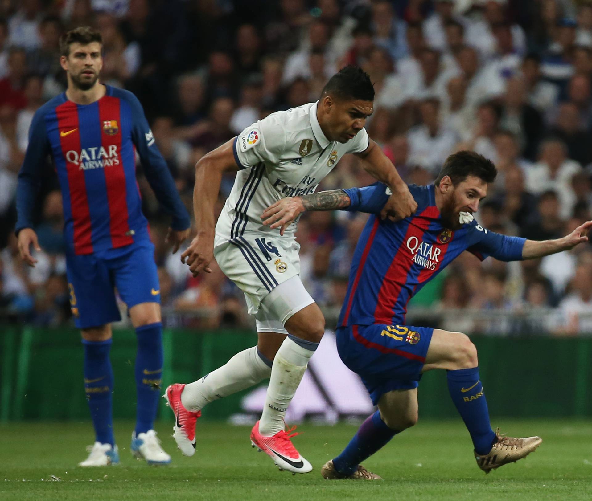 Barcelona's Lionel Messi in action with Real Madrid's Casemiro