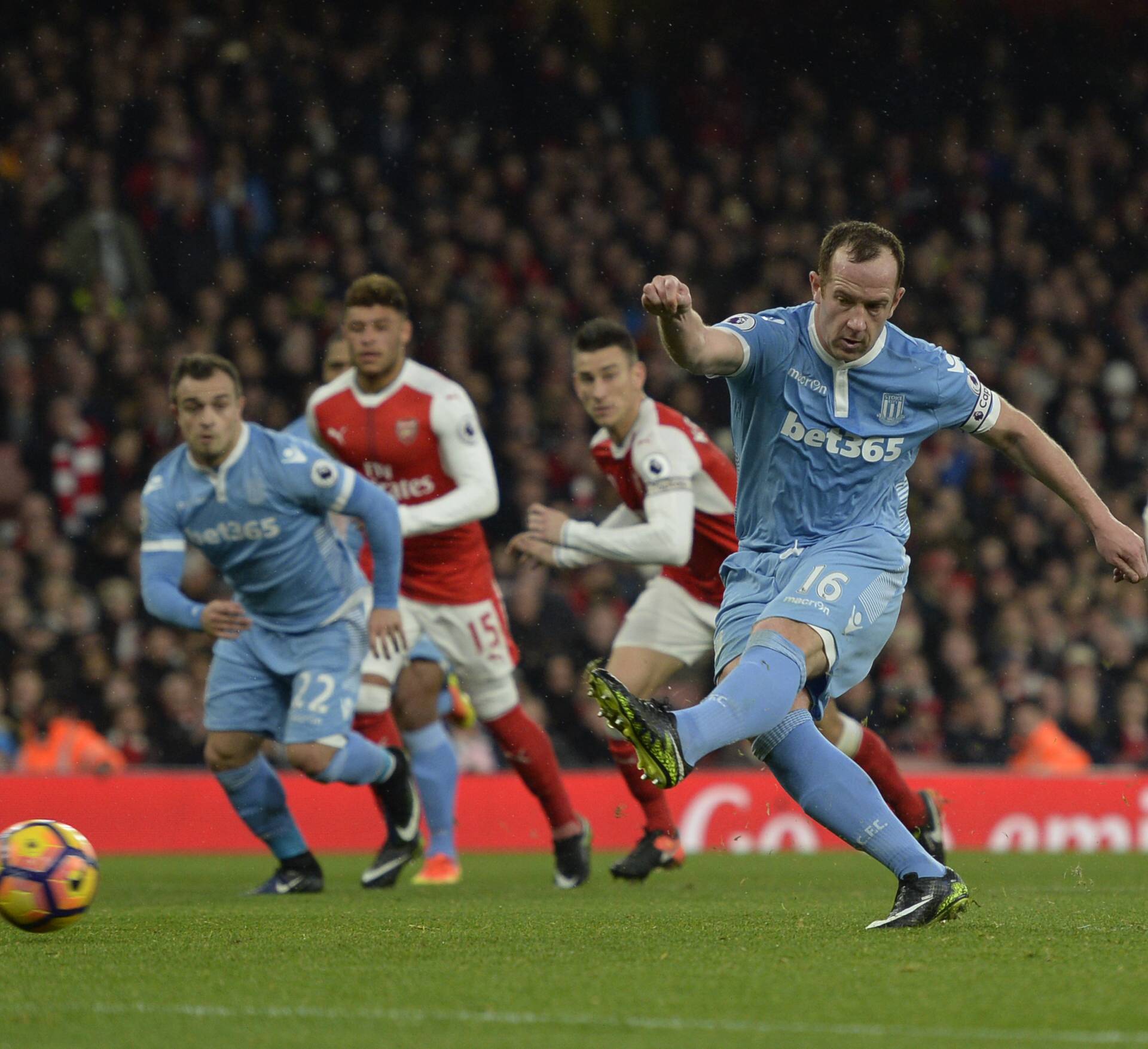 Stoke City's Charlie Adam scores their first goal from the penalty spot