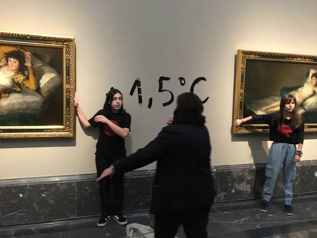 Climate protesters from Extinction Rebellion stick themselves to Goya's "Las Majas" paintings to alert about the climate emergency in Madrid