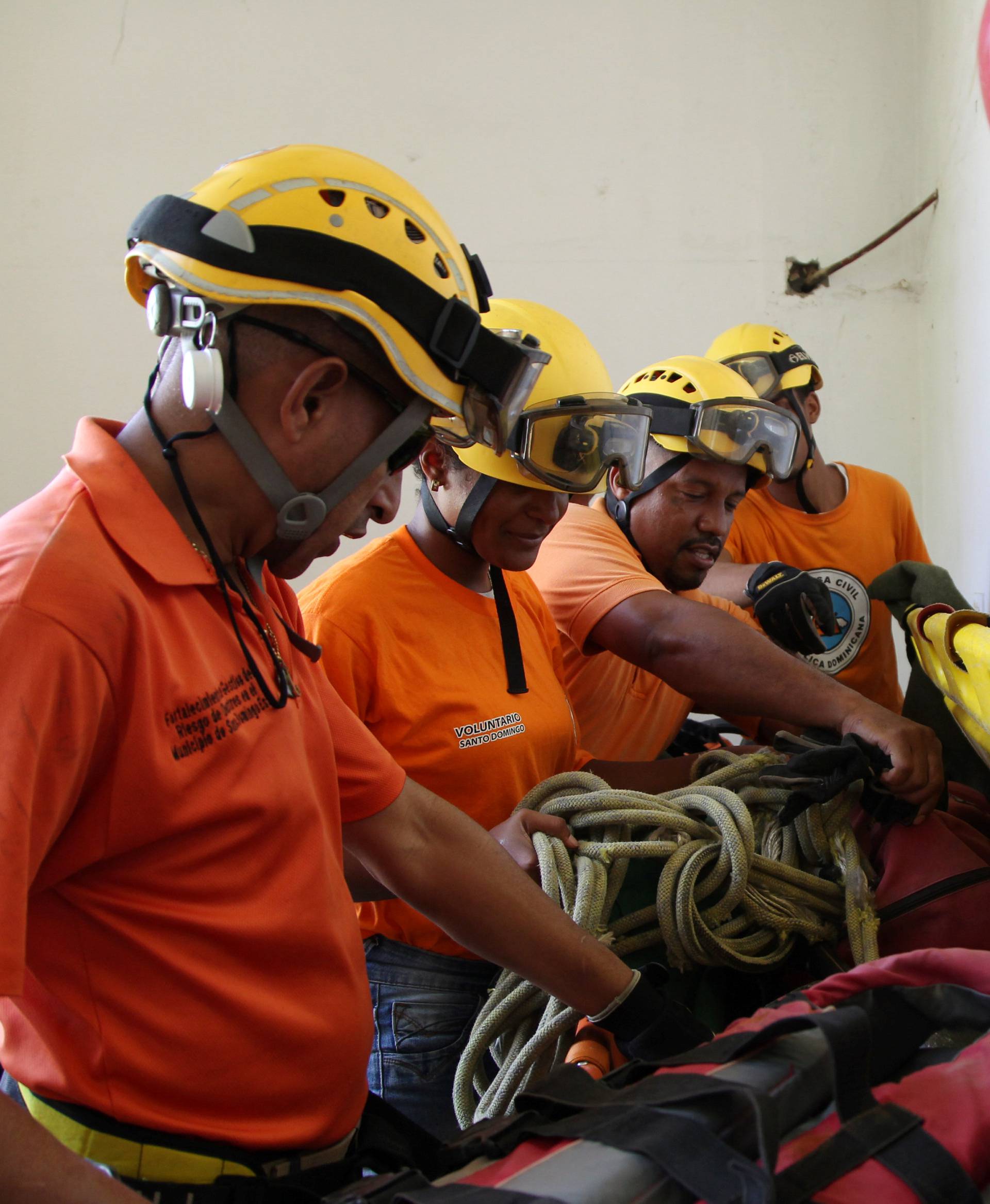 Members of the Civil Defense prepare their gear ahead of Hurricane Irma, in Santo Domingo