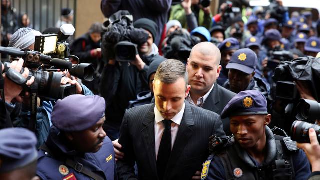 Former Paralympian Oscar Pistorius arrives to be sentenced for murder of his girlfriend Reeva Steenkamp at the Pretoria High Court